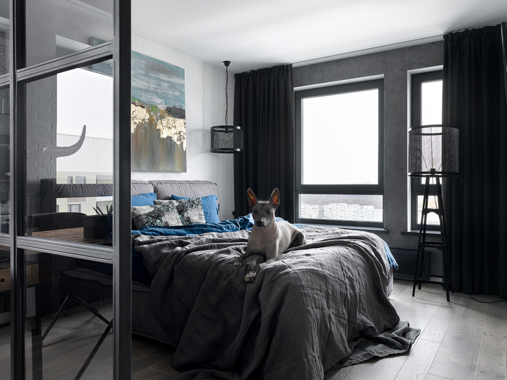 Mid-sized urban bedroom photo in Moscow with white walls