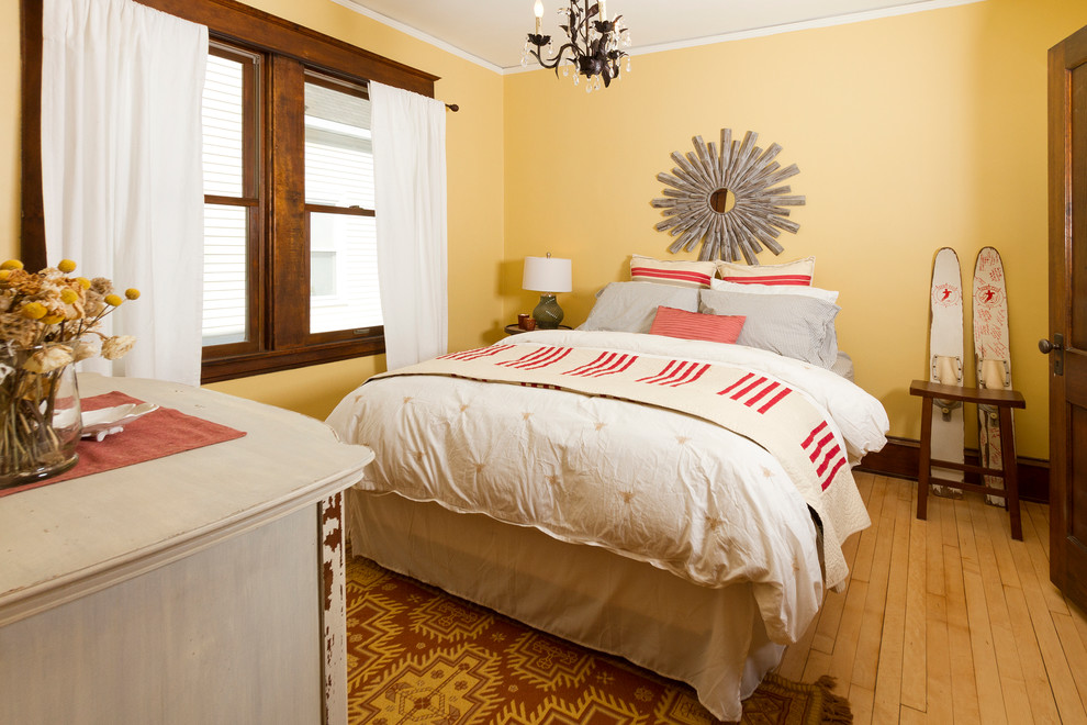 Bedroom - craftsman guest light wood floor bedroom idea in Minneapolis with yellow walls
