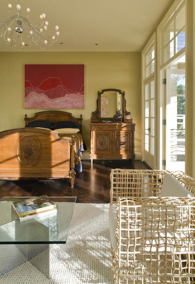 Inspiration for a contemporary dark wood floor bedroom remodel in San Francisco with beige walls