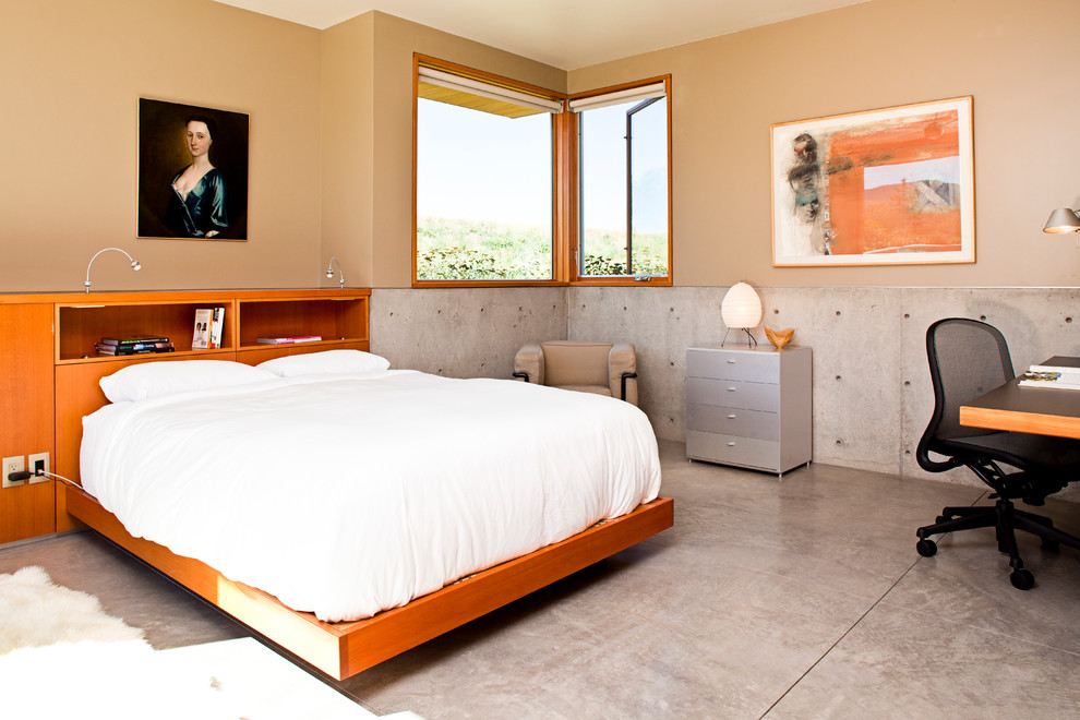Design ideas for a medium sized modern guest bedroom in Denver with concrete flooring.