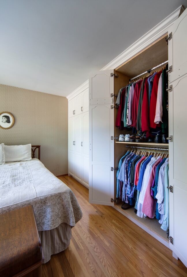 Photo of a medium sized traditional master bedroom in Toronto with beige walls, medium hardwood flooring and no fireplace.