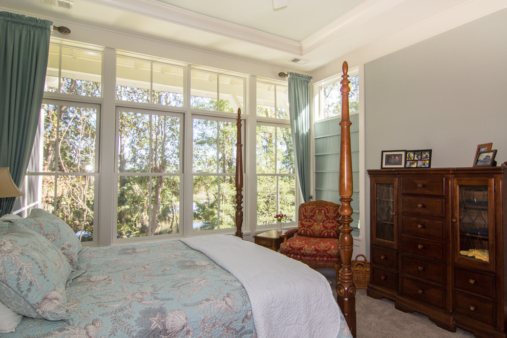 Design ideas for a medium sized traditional master bedroom in Charleston with blue walls and carpet.