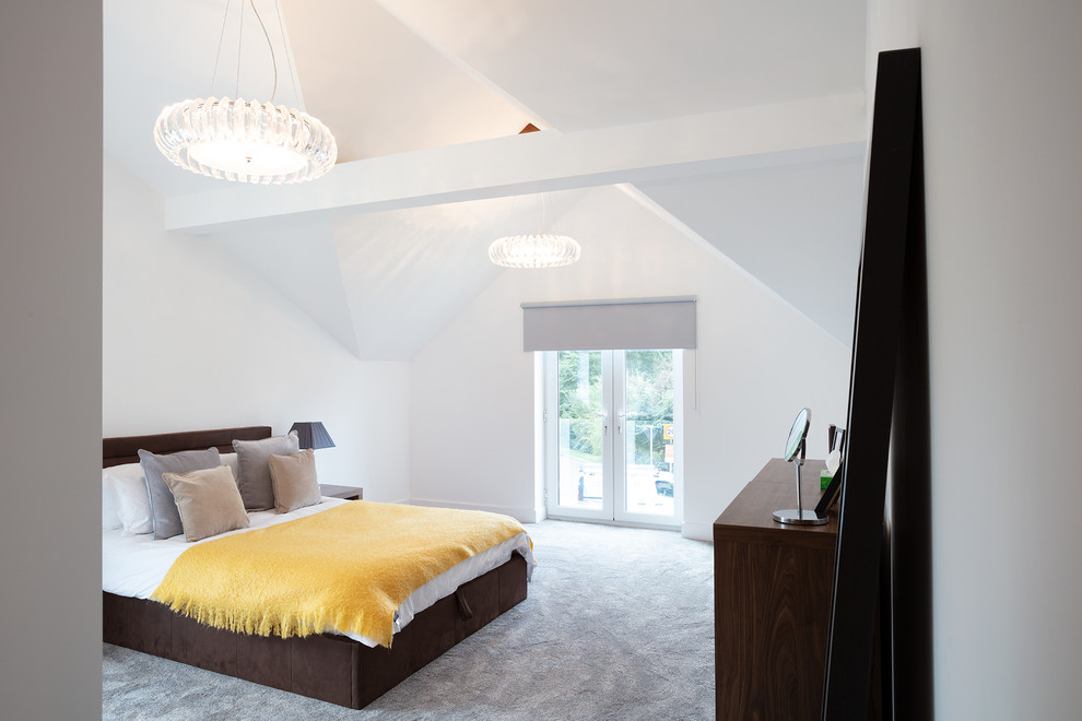 Design ideas for a large contemporary master bedroom in Berkshire with white walls, carpet and grey floors.