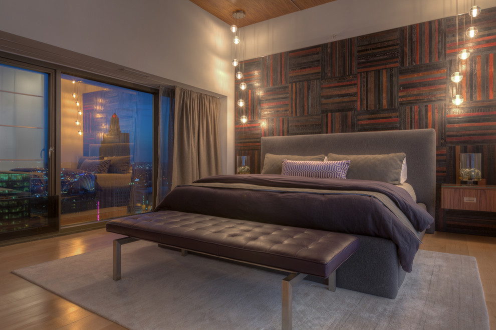 Bedroom - huge modern master light wood floor bedroom idea in Kansas City with white walls