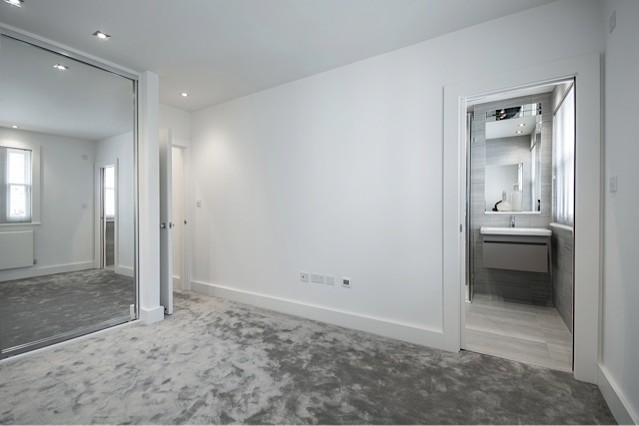 Example of a minimalist bedroom design in Essex