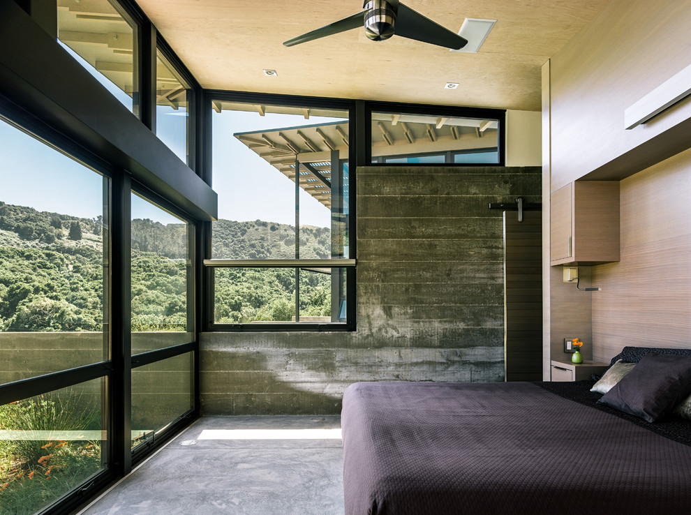 Diseño de dormitorio actual con suelo de cemento