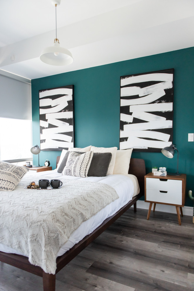 Immagine di una camera da letto contemporanea di medie dimensioni con pareti verdi e pavimento grigio