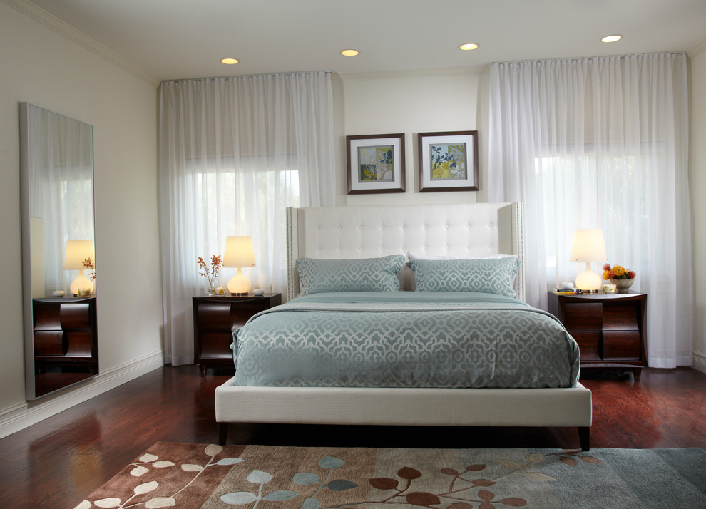 Inspiration for a large contemporary master bedroom in Miami with white walls, dark hardwood flooring and brown floors.