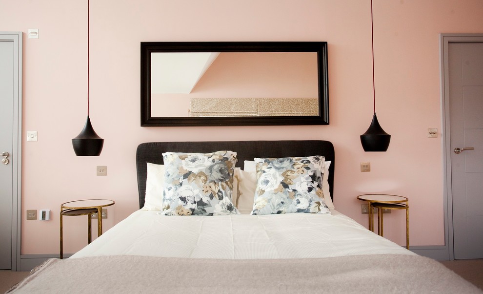 Transitional master bedroom photo in Surrey with pink walls