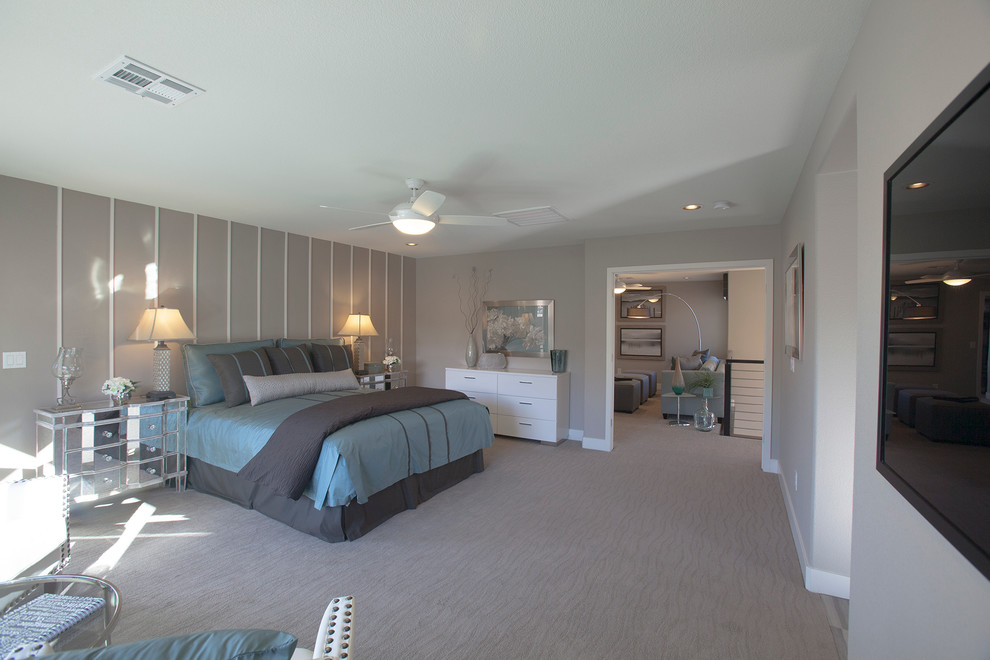 Example of a large trendy master carpeted bedroom design in Las Vegas with gray walls