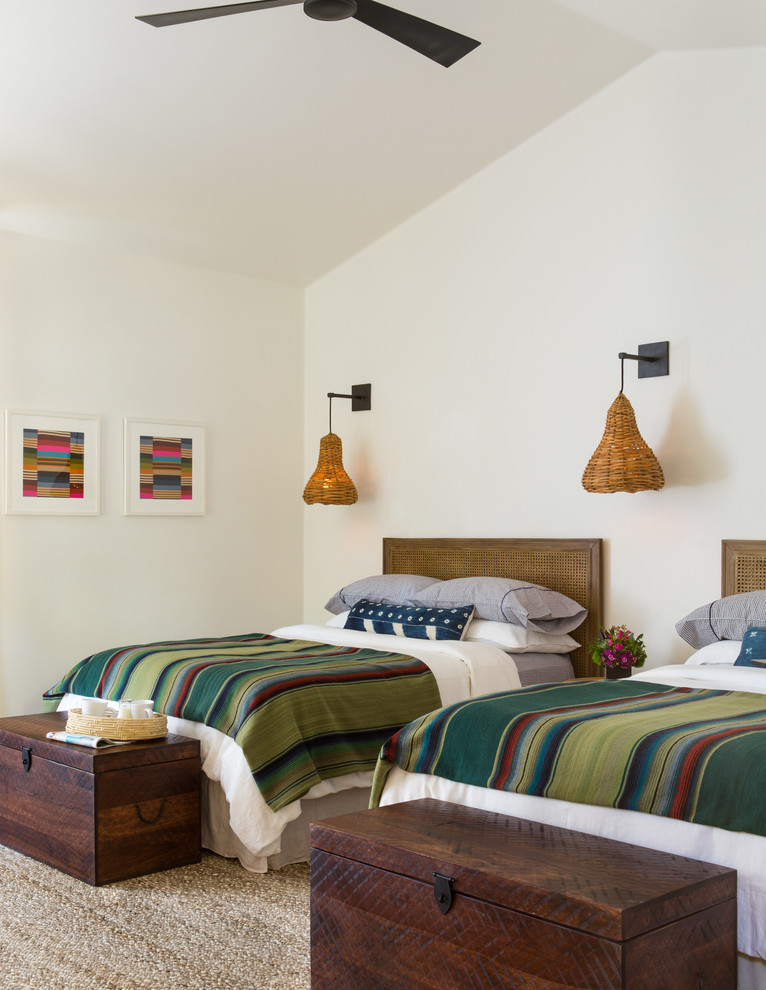 Example of a tuscan bedroom design with white walls