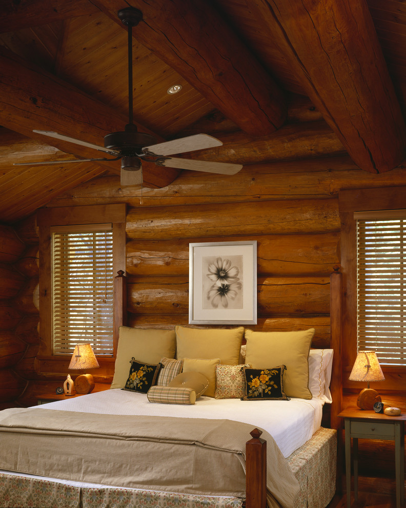 Photo of a rustic guest bedroom in Denver with feature lighting.