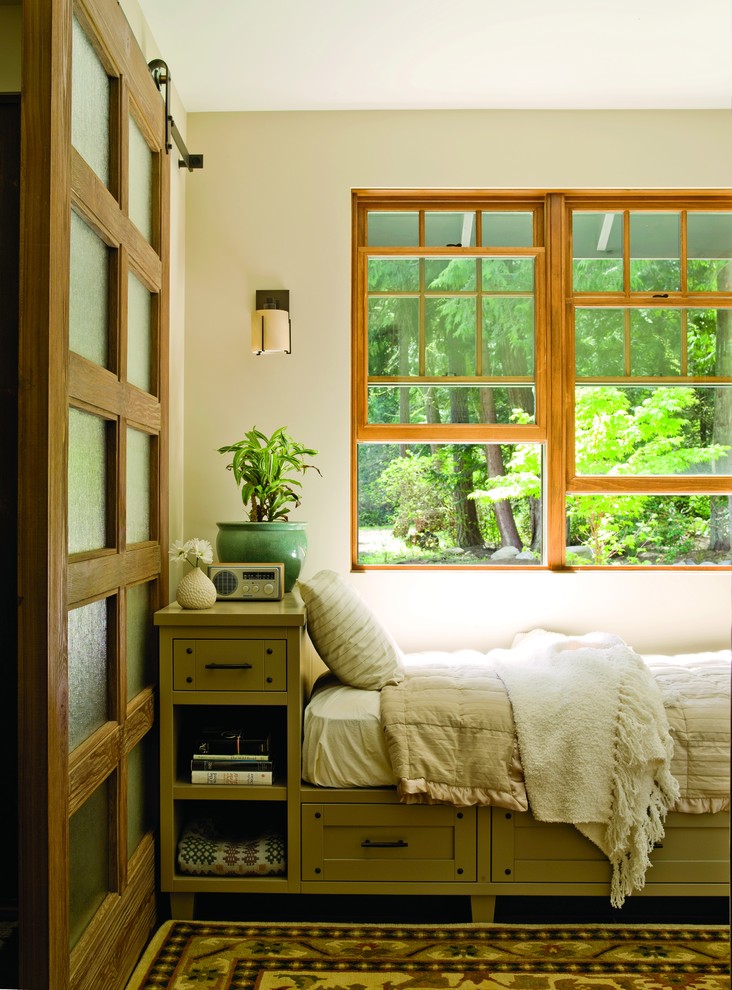 Example of a mid-sized classic guest carpeted and multicolored floor bedroom design in Seattle with beige walls and no fireplace