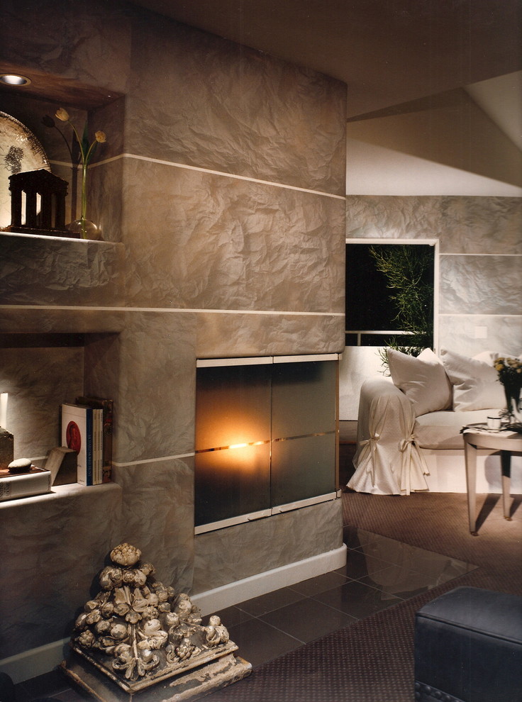 На фото: большая хозяйская спальня в стиле модернизм с серыми стенами, полом из линолеума, угловым камином и фасадом камина из плитки с