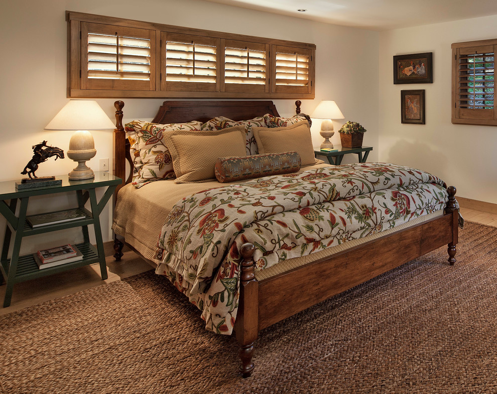 Photo of a rustic bedroom in Santa Barbara with white walls.