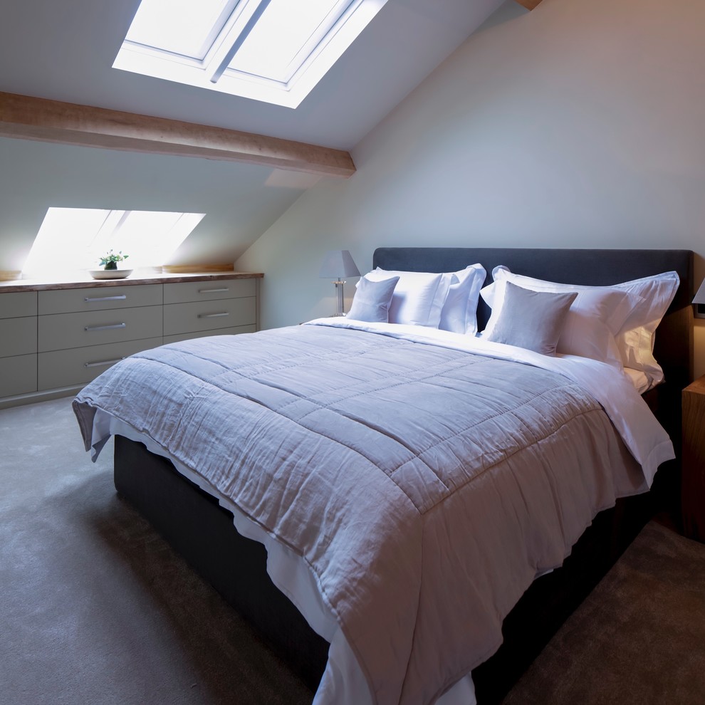Photo of a medium sized contemporary master bedroom in West Midlands with white walls and carpet.