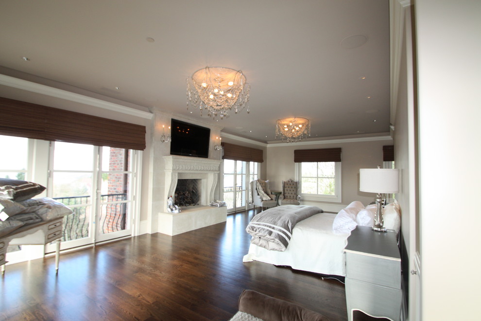 Elegant master dark wood floor bedroom photo in Portland