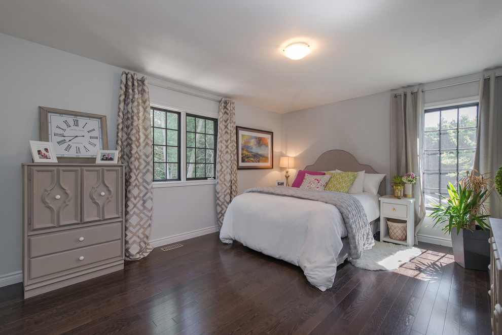 Mid-sized transitional guest dark wood floor and brown floor bedroom photo in Toronto with white walls