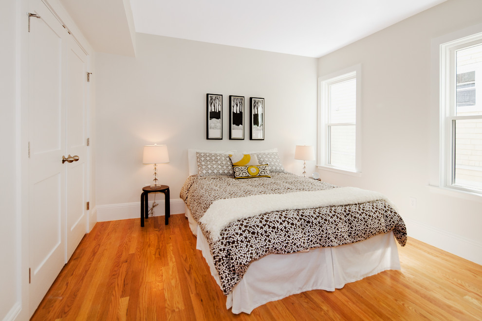 Example of a mid-sized trendy light wood floor bedroom design in Boston with gray walls