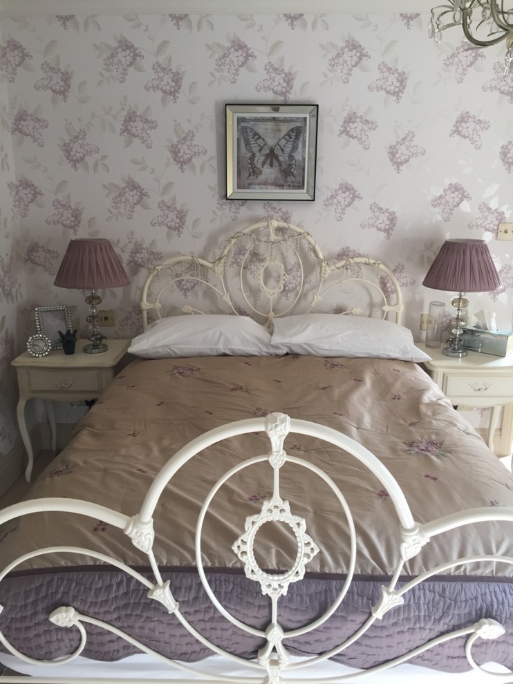 Photo of a large country bedroom in Cambridgeshire.