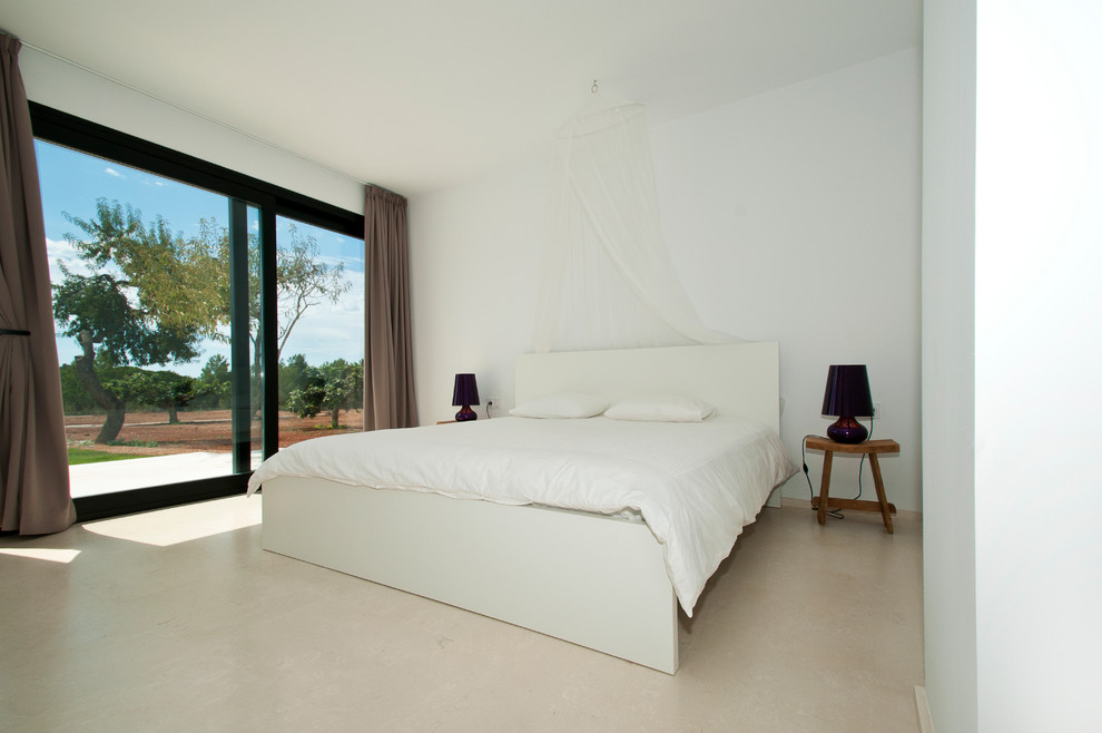 Example of a mid-sized tuscan master bedroom design in Other with white walls and no fireplace