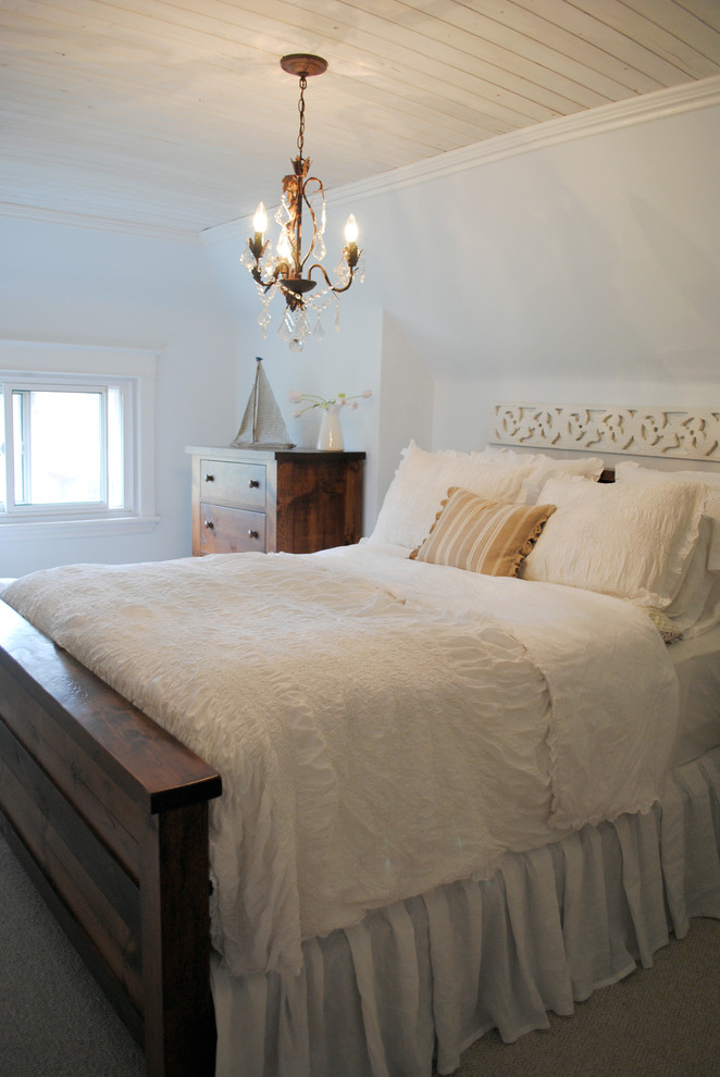 Photo of a shabby-chic style bedroom in Other with white walls, carpet and no fireplace.