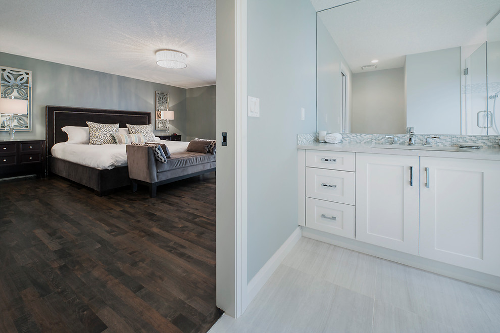 Inspiration for a large transitional master dark wood floor bedroom remodel in Calgary with gray walls and no fireplace