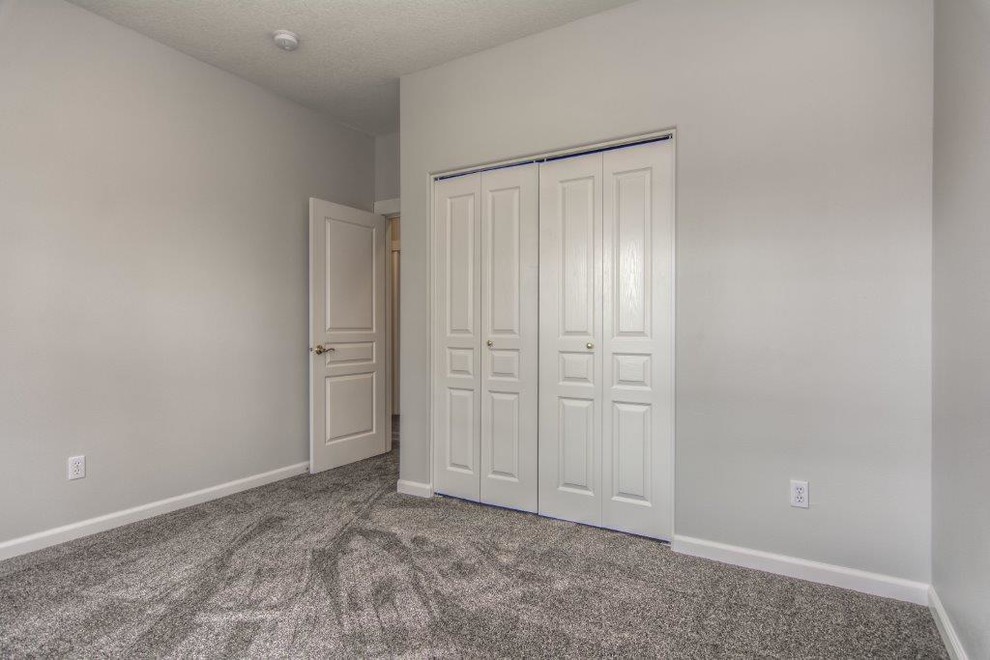 Small elegant guest carpeted and gray floor bedroom photo in Portland with gray walls and no fireplace