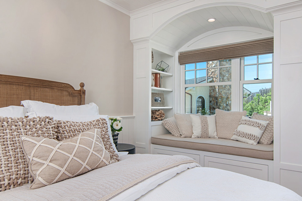 Inspiration for a mid-sized timeless guest medium tone wood floor bedroom remodel in San Diego with white walls and no fireplace