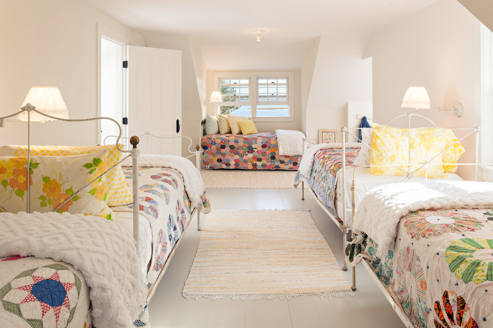 Example of a beach style guest painted wood floor bedroom design in Boston with white walls