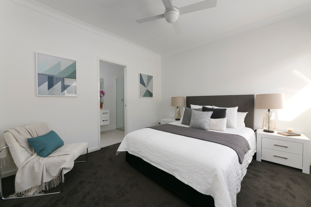 Large minimalist master carpeted bedroom photo in Brisbane with white walls