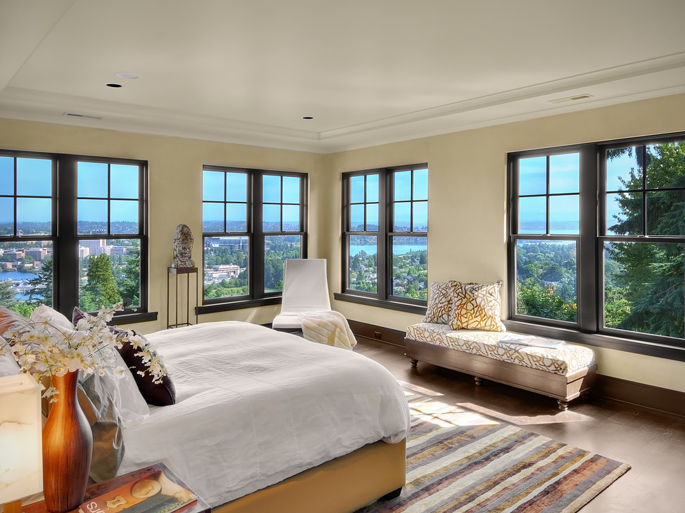 Inspiration for a medium sized contemporary master bedroom in Seattle with beige walls and dark hardwood flooring.