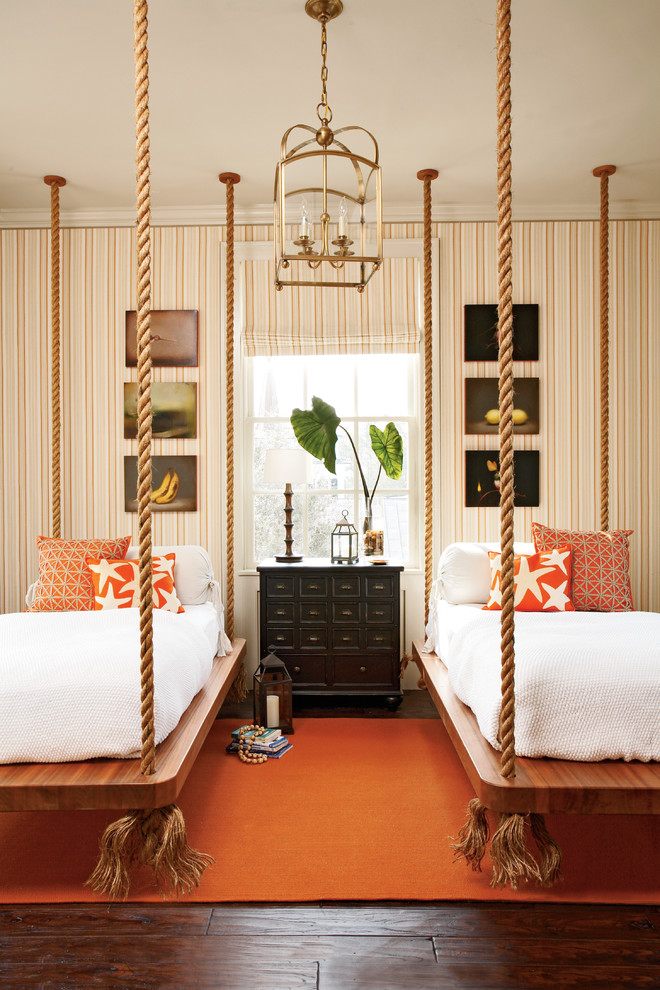 Coastal guest bedroom in Atlanta with multi-coloured walls and dark hardwood flooring.