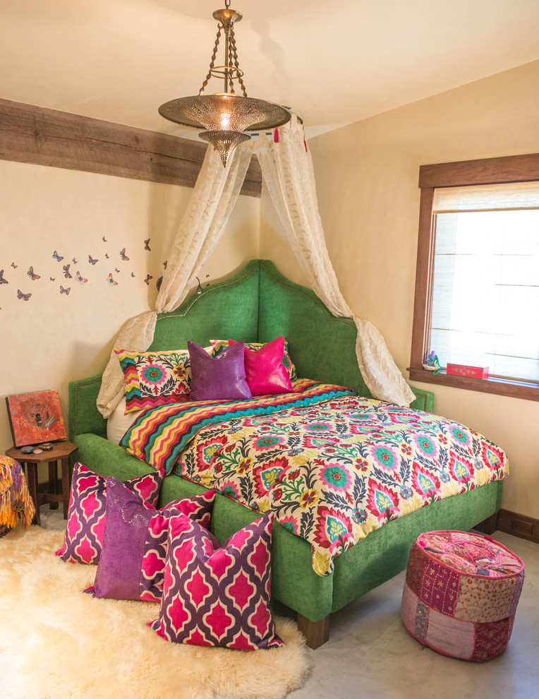 Inspiration for a mediterranean carpeted bedroom remodel in Denver with beige walls