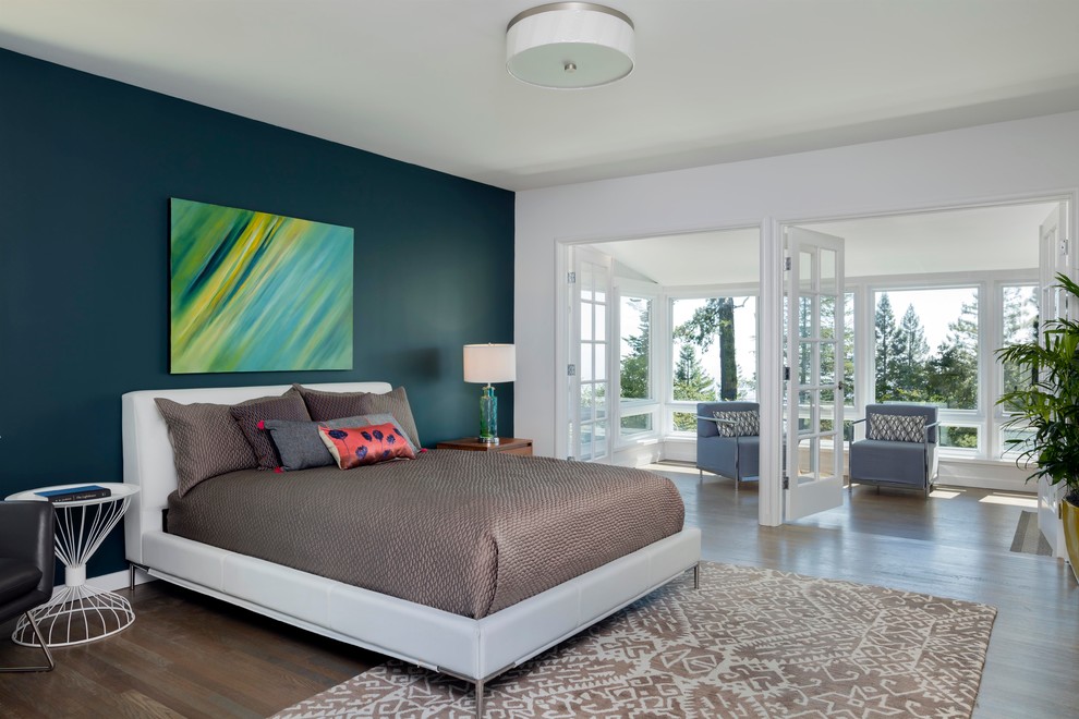 Example of a transitional master medium tone wood floor bedroom design in San Francisco with green walls