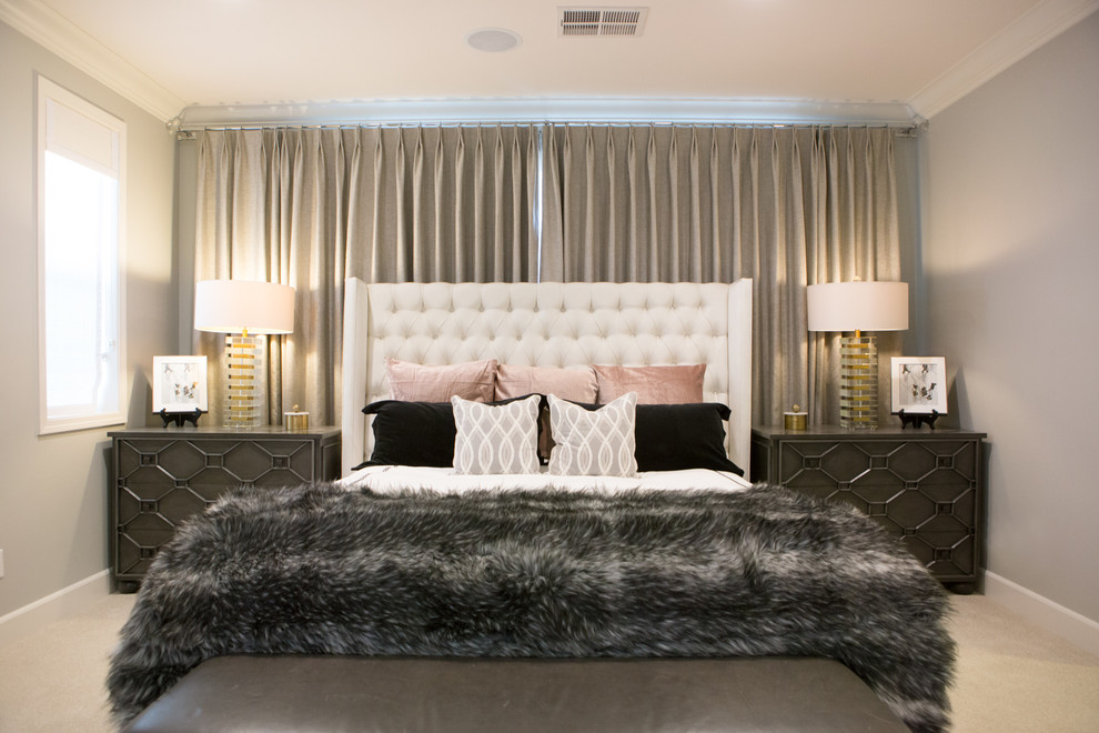 Example of a large trendy master carpeted and beige floor bedroom design in San Diego with gray walls, a standard fireplace and a wood fireplace surround