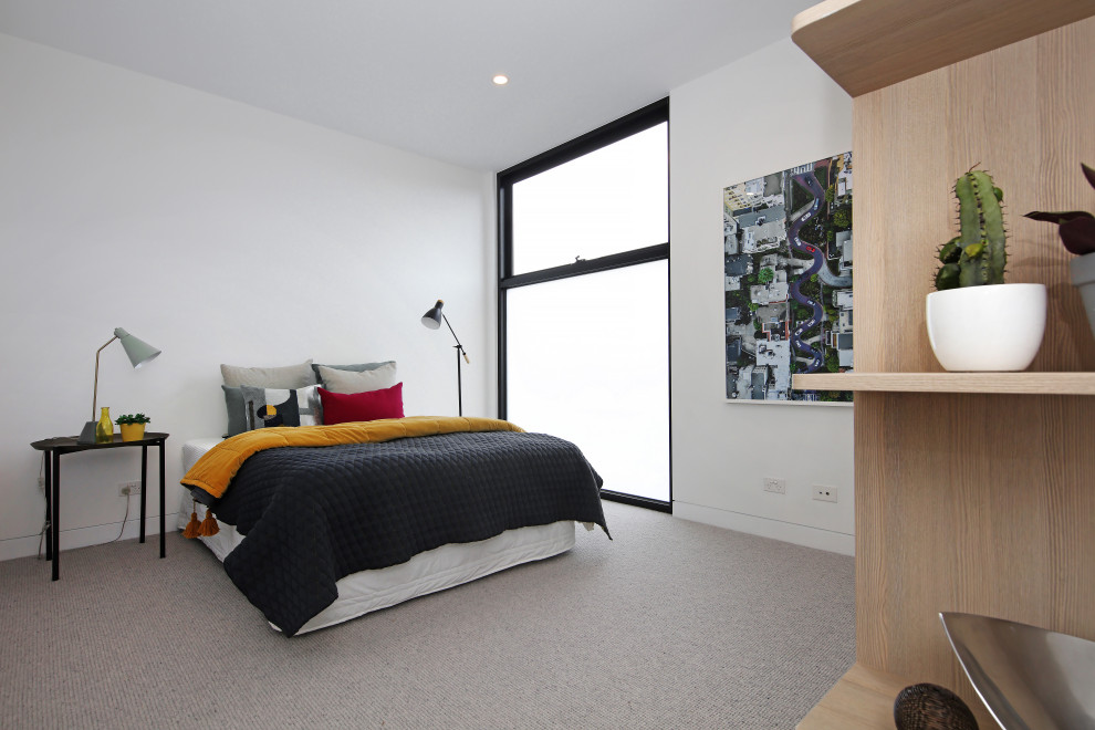Ejemplo de dormitorio actual con paredes blancas y suelo gris