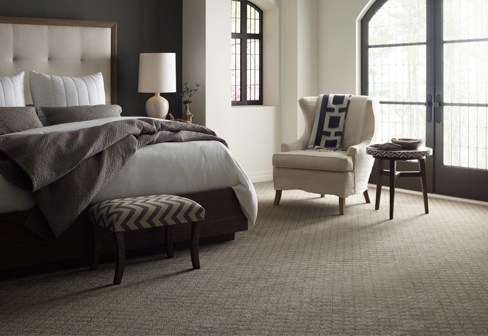 Design ideas for a medium sized traditional master bedroom in Other with beige walls, carpet and beige floors.
