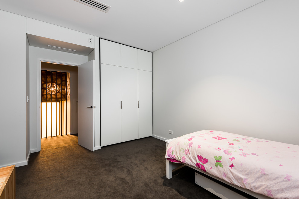 This is an example of a contemporary bedroom in Perth.
