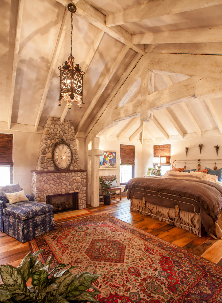 This is an example of a rustic bedroom in Dallas.