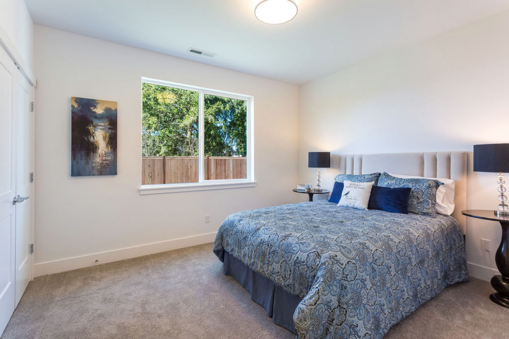This is an example of a medium sized modern bedroom in Seattle with white walls, carpet and beige floors.