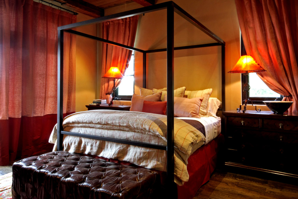 Mediterranean bedroom in Austin with feature lighting.