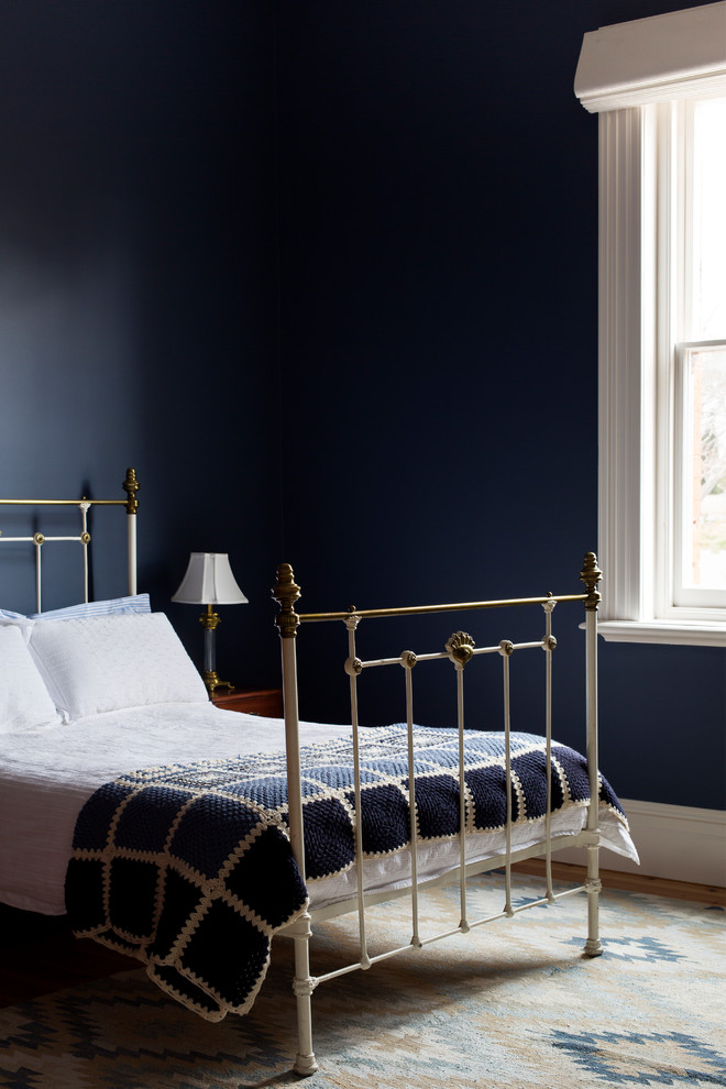 Medium sized traditional guest bedroom in Melbourne with blue walls and light hardwood flooring.