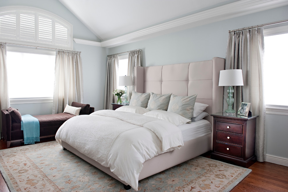 Bedroom - traditional medium tone wood floor bedroom idea in New York with gray walls