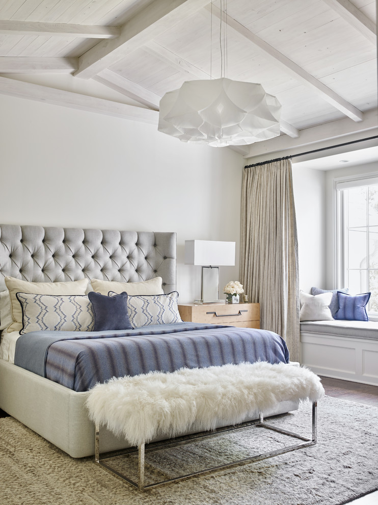 Beach style master bedroom in Atlanta with white walls.