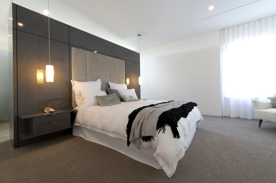 Diseño de habitación de invitados moderna con moqueta