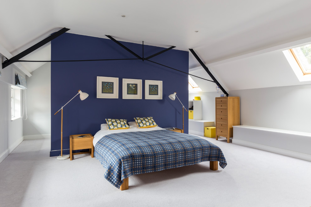 Contemporary master bedroom in London with white walls, carpet and white floors.