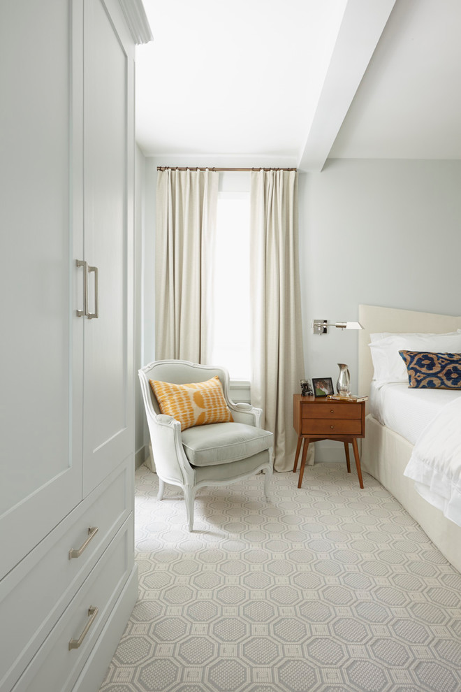 Transitional bedroom photo in New York with gray walls