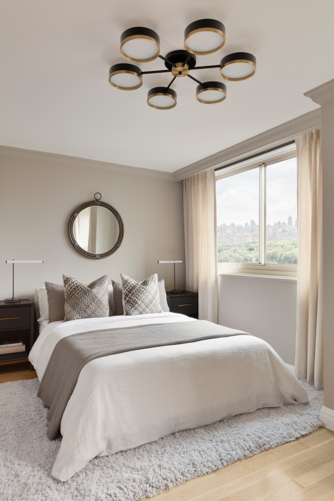 Photo of a contemporary bedroom in New York with grey walls, light hardwood flooring and beige floors.