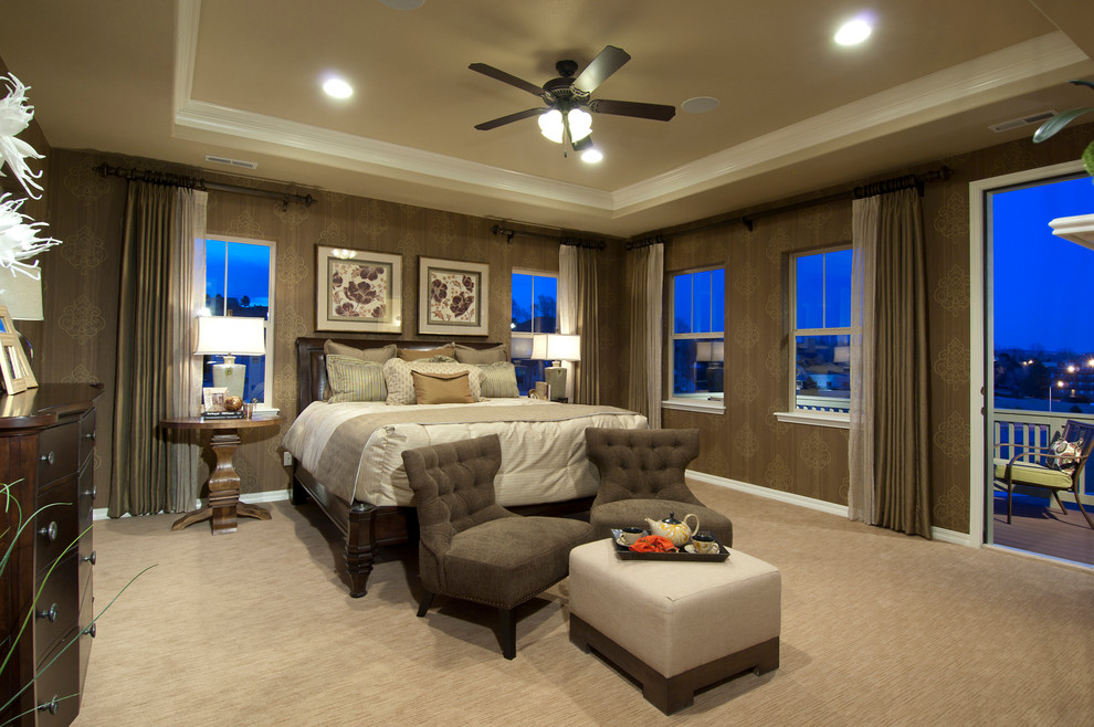 Photo of a traditional bedroom in Denver with brown walls and carpet.